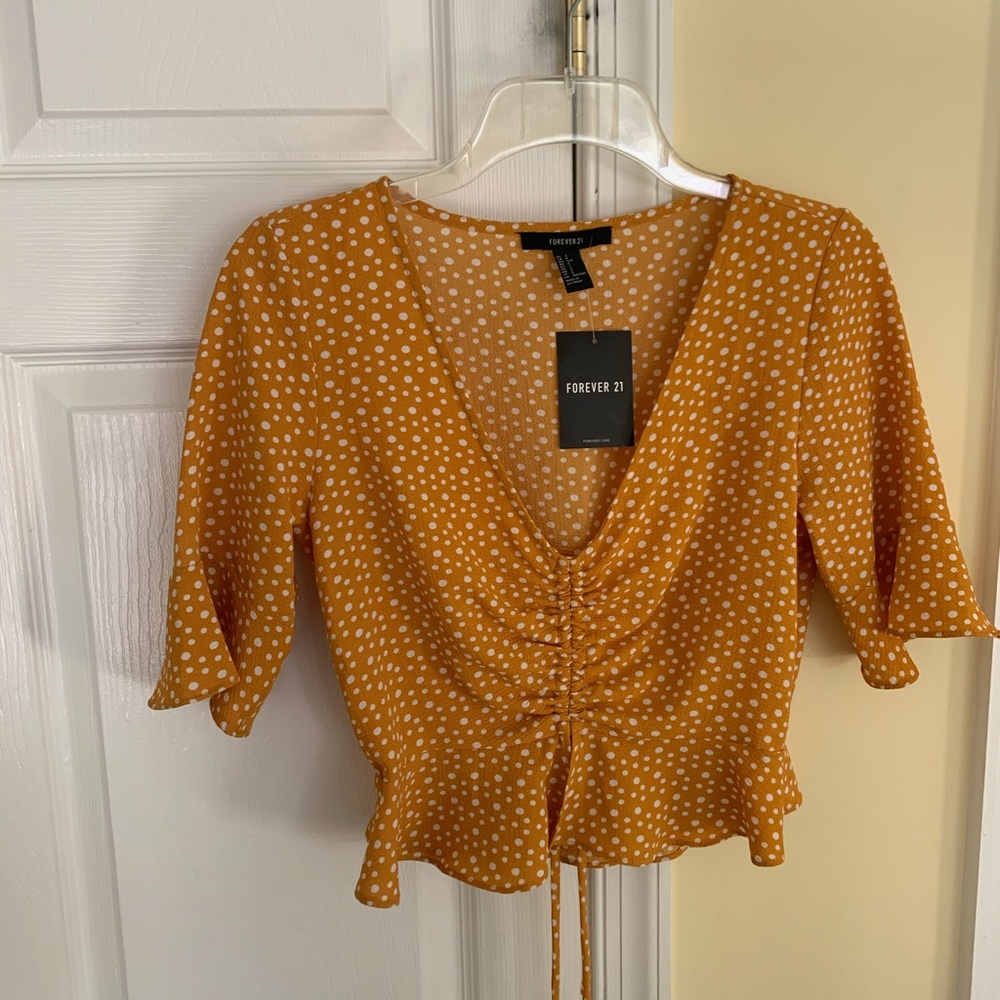 Yellow and white polka dot shirt